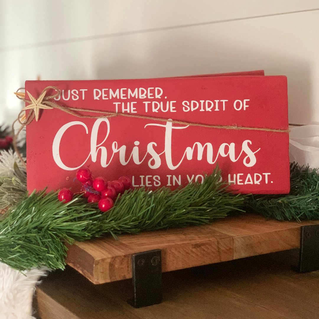 12"x5" shelf sitter-Just Remember The True Spirit Of Christmas Lies In Your Heart.  Giving, not getting, brings to full bloom the Christmas spirit. We feel more kindly one to another. Great gift idea for the holiday season to remind us what Christmas is all about.