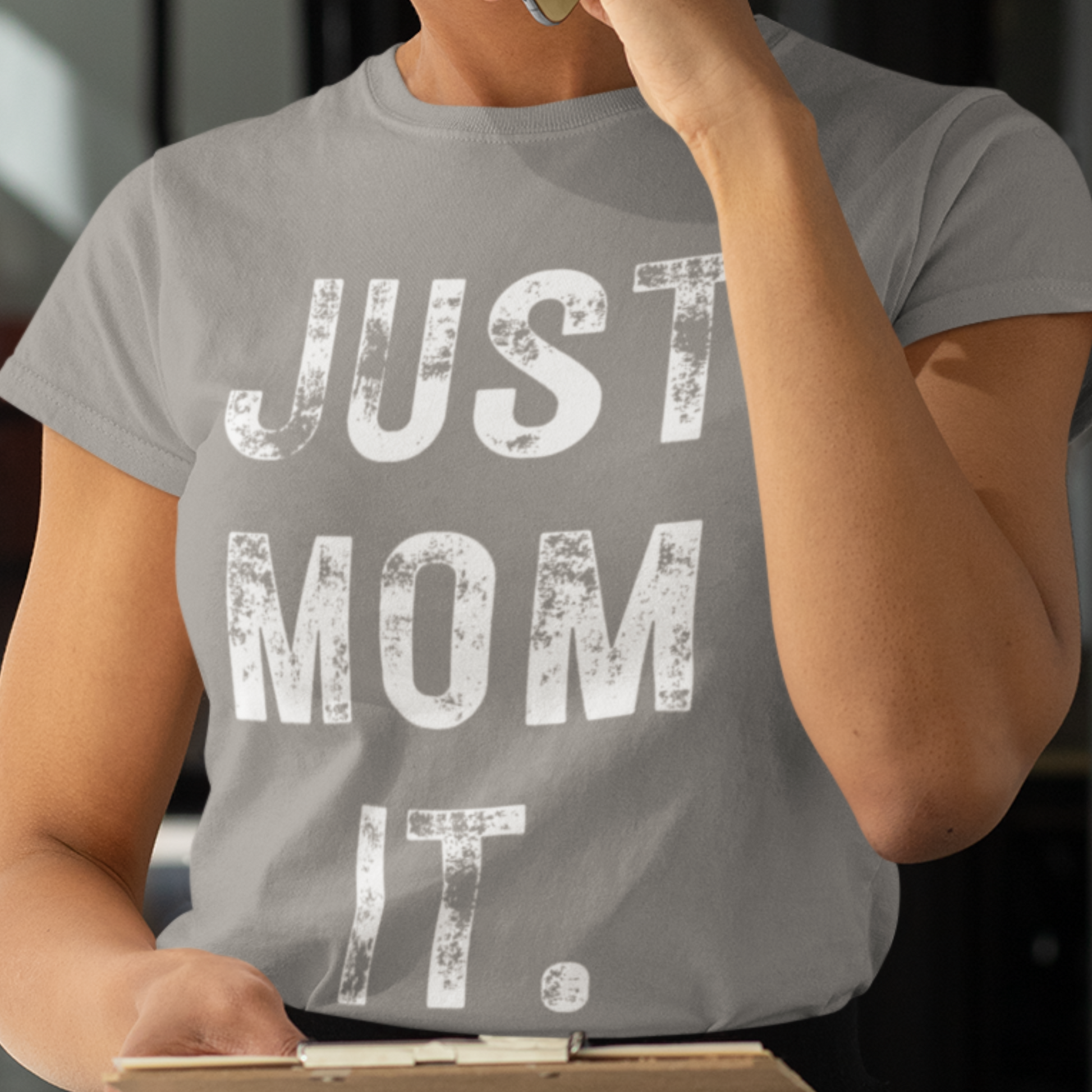 Close-up of the Just Mom Empower Tee with empowering text 'Empowering Moms' on a soft cotton fabric. Ideal for modern moms looking for both comfort and style.