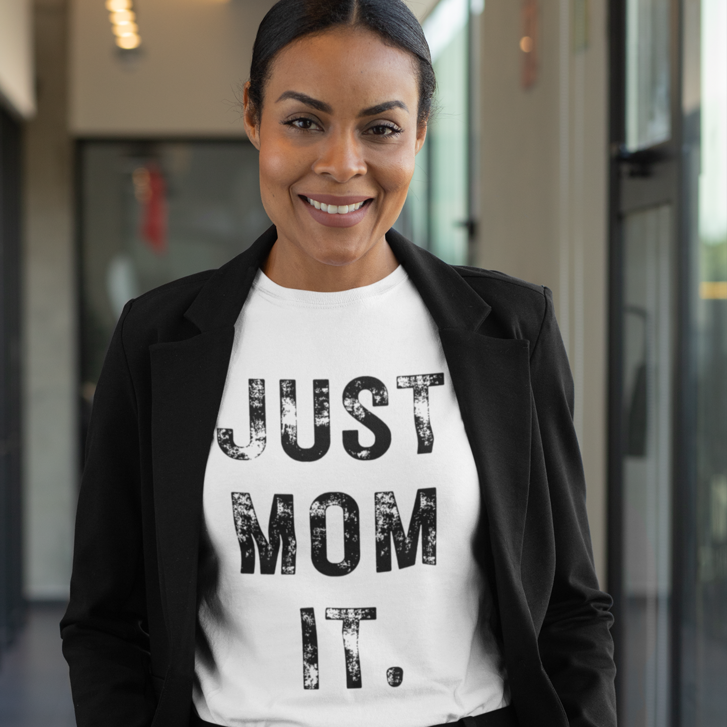 Just Mom Empower Tee featuring empowering text for modern moms. Soft cotton shirt with a stylish design, available in various sizes and colors.