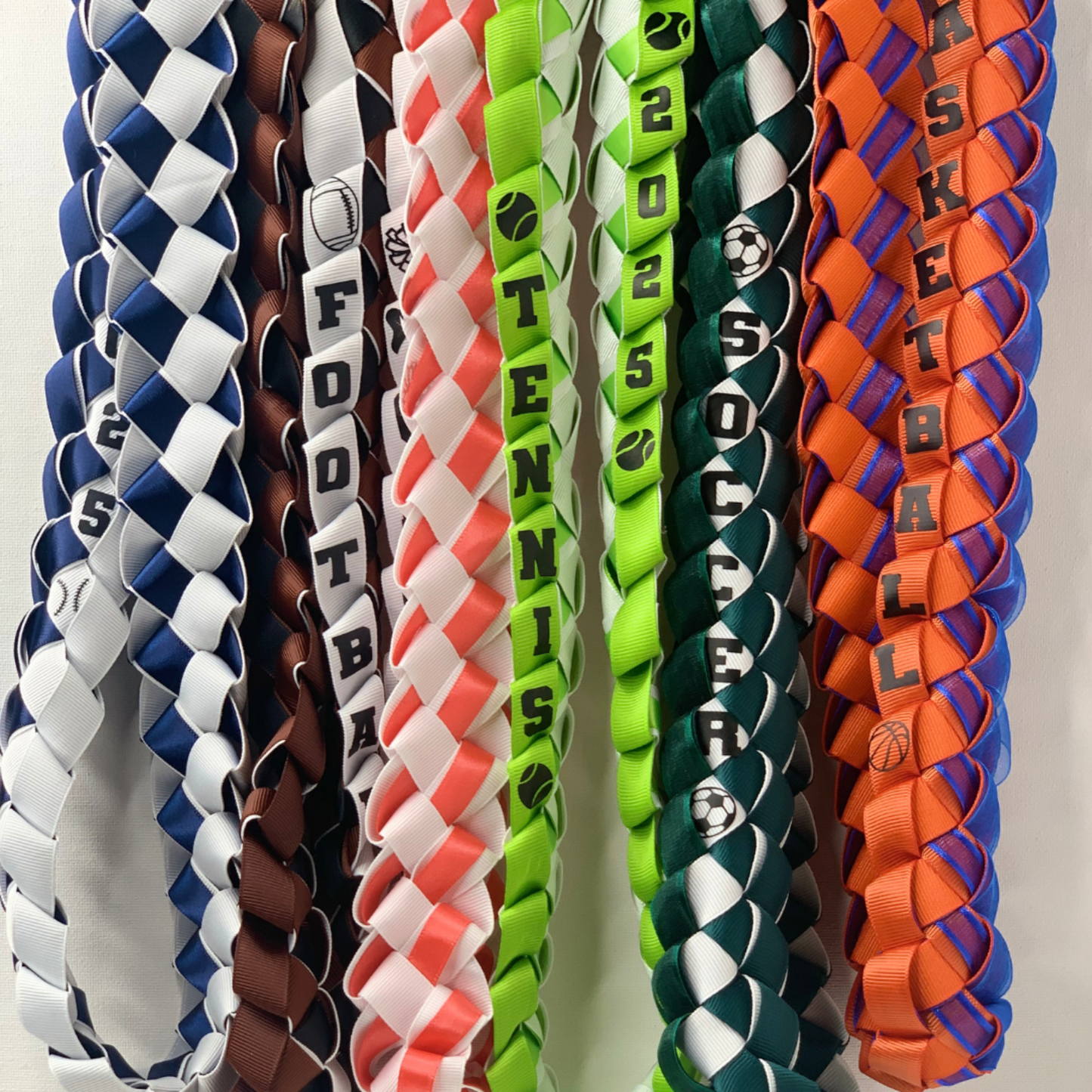 Custom sports senior night ribbon leis, personalized with athlete's name and jersey number for a unique graduation gift for your player or the entire team!.